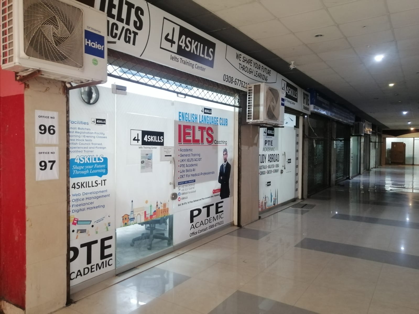 The 4Skills shopfront inside Koh-e noor-1 Plaza, Jaranwala Road, Faisalabad, showing the office number 96 and 97 plates beside the entrance